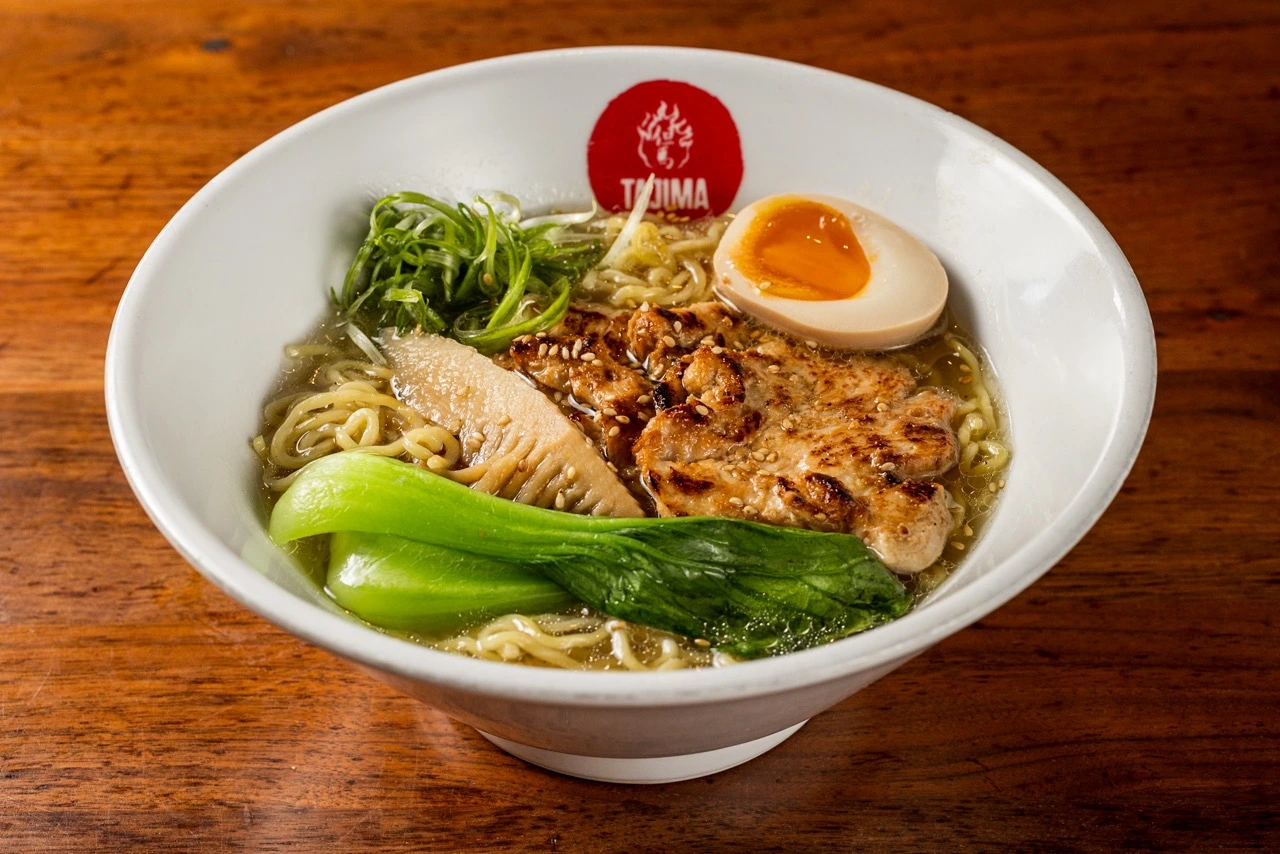 Chicken Ramen, grilled sliced chicken, half a seasoned egg, bok choy, bamboo shoot and scallion on clear broth with ramen noodles