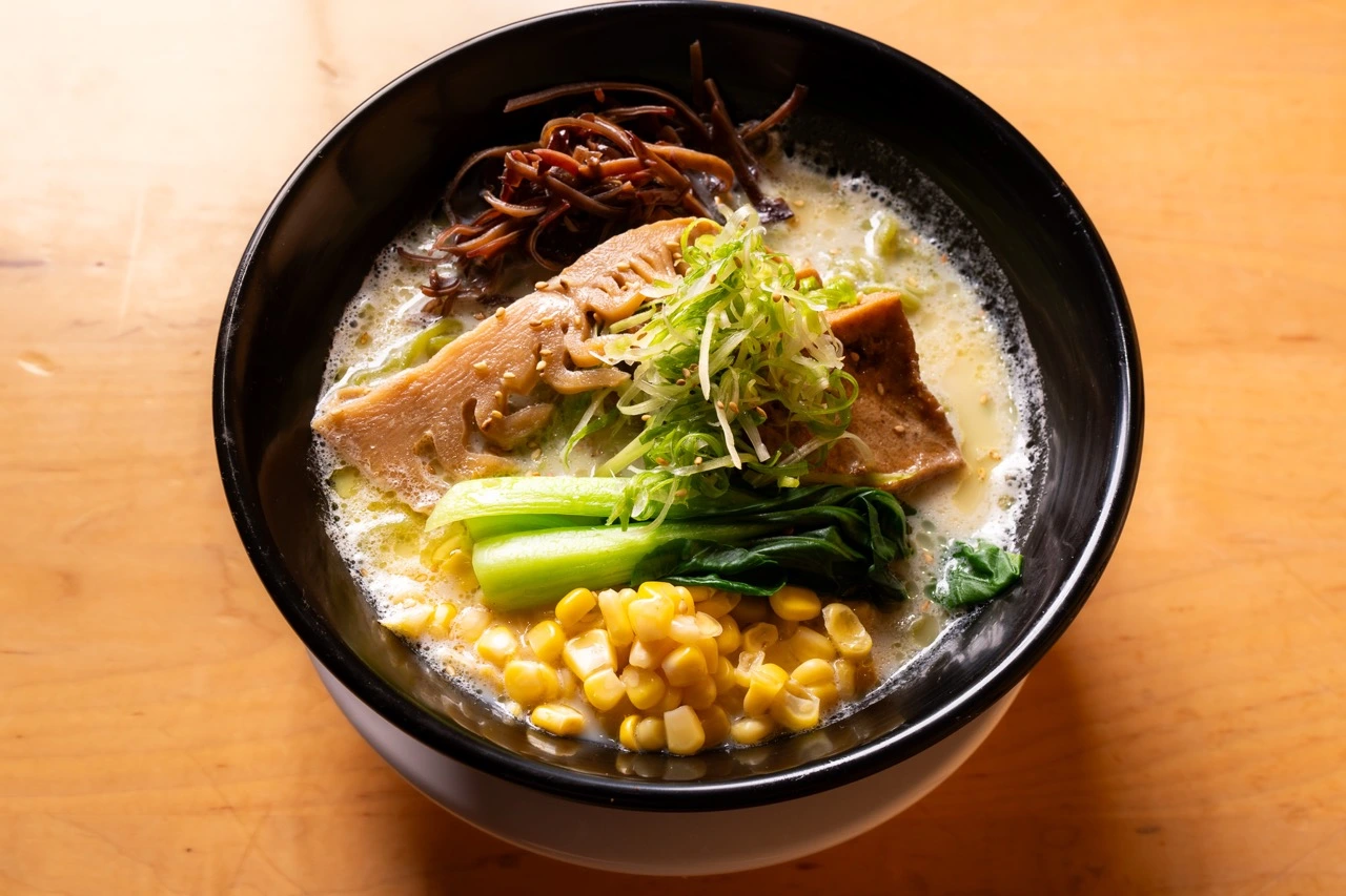 Vegan Ramen with green spinach noodles, marinated tofu and soy-based broth